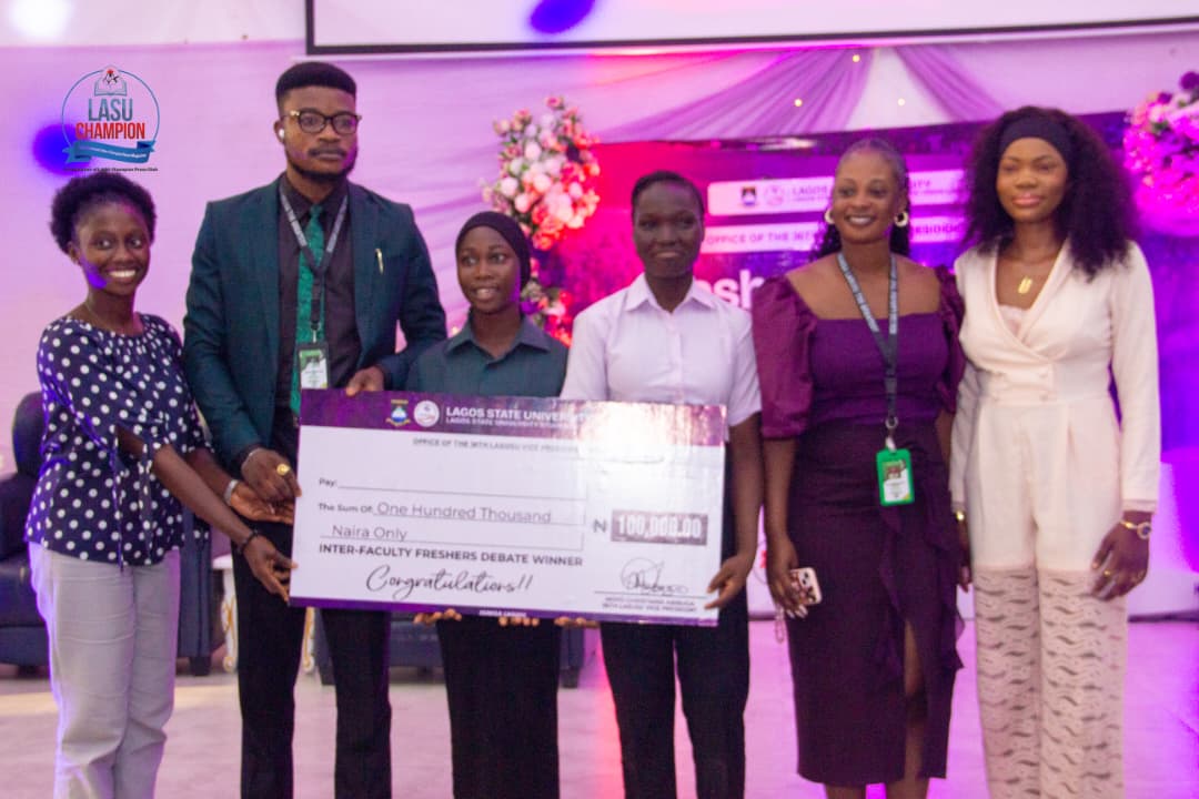 LASUSU PRESIDENT PRESENTING THE AWARD OF CASH GIFT TO THE INTER-FACULTY DEBATES WINNERS